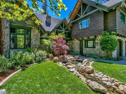 a front view of a house with garden