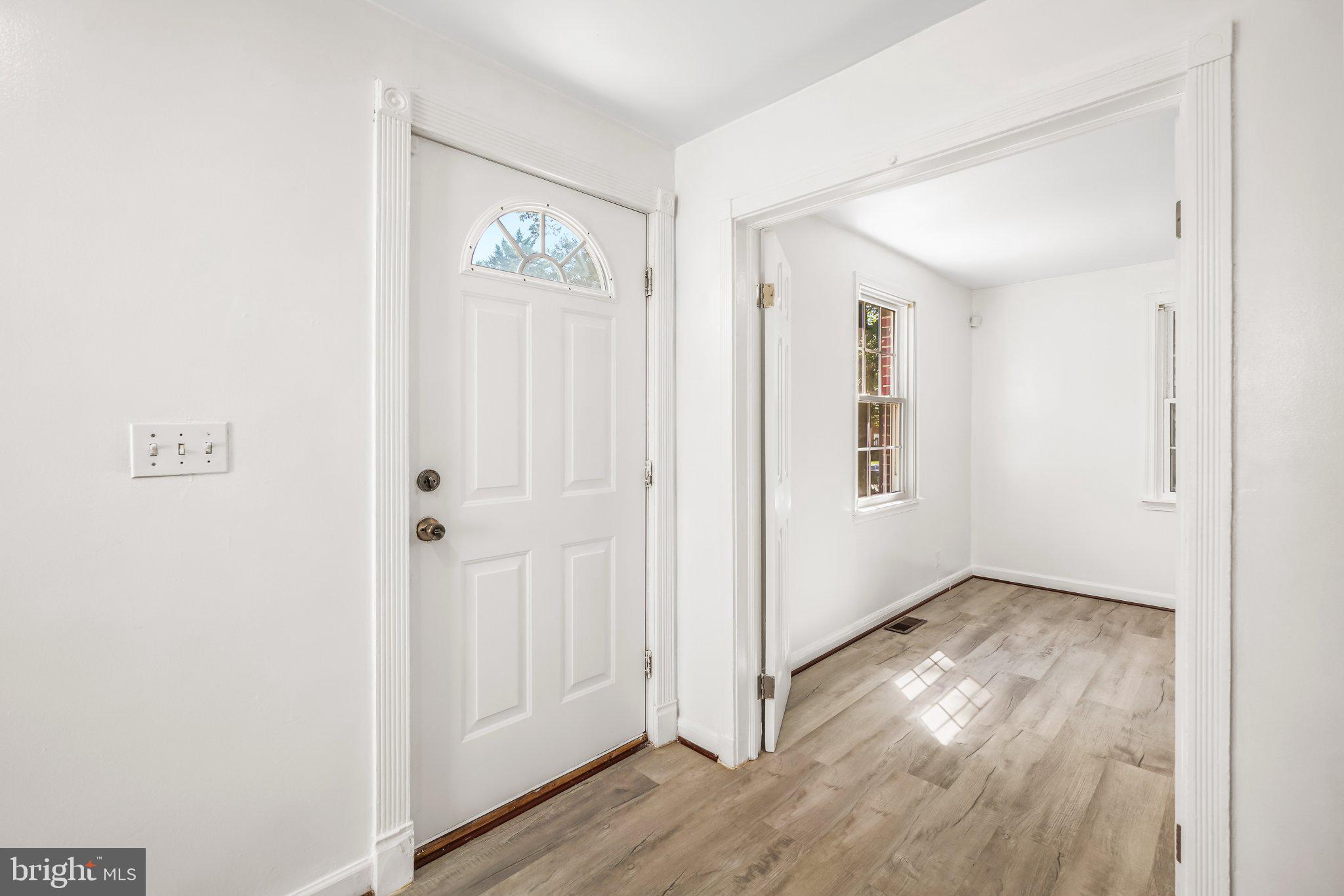 7022 Deerfield Road Pikesville, MD 21208 - Photo 6 of 30 Bright and inviting entryway space.