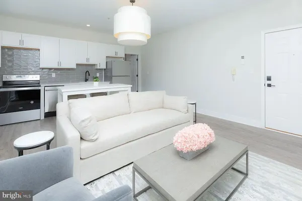 a living room with furniture and a table