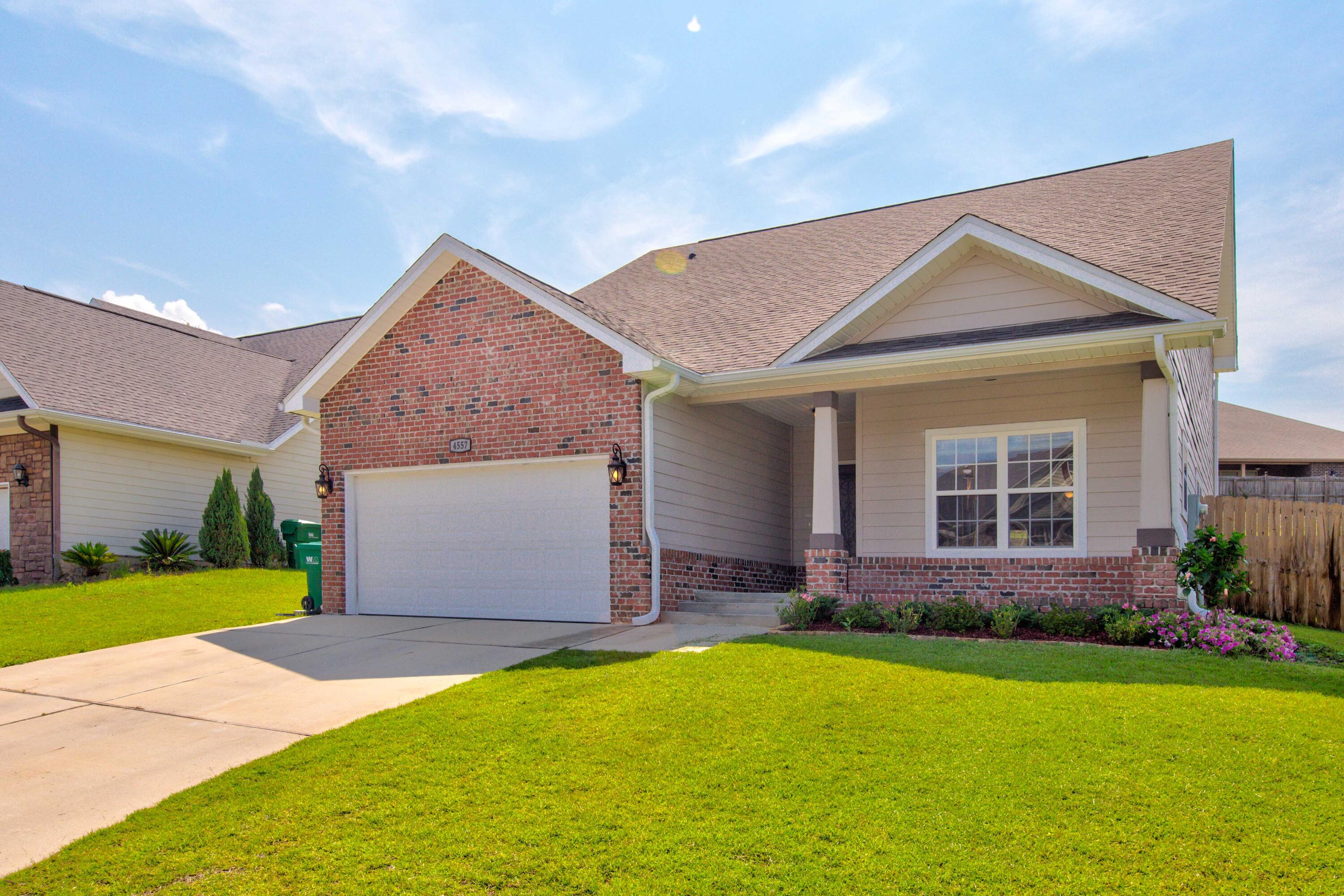 4557 Hermosa Road Crestview, FL 32539 - Photo 2 of 29 a front view of a house with garden