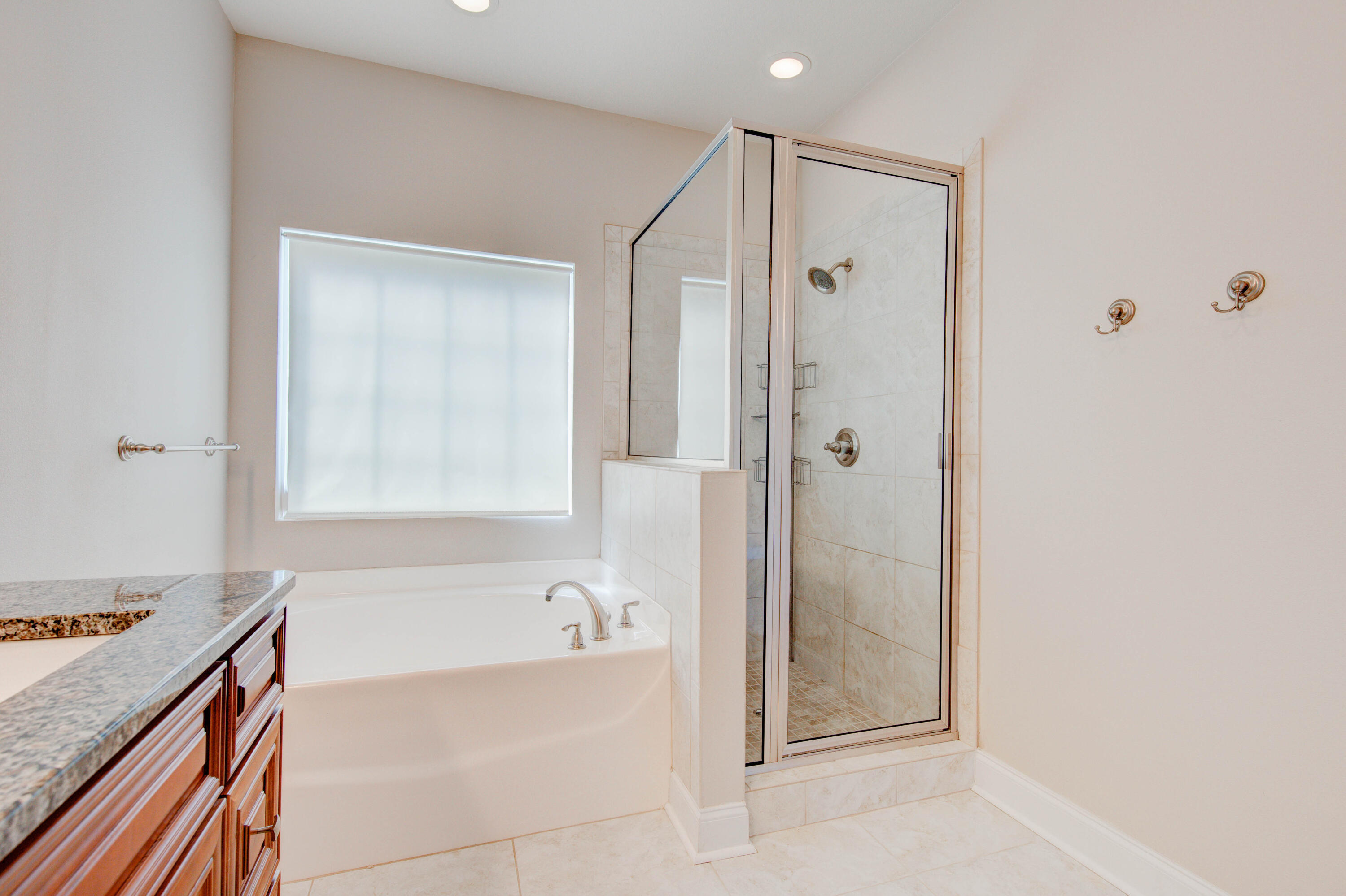 4557 Hermosa Road Crestview, FL 32539 - Photo 20 of 29 a bathroom with a tub shower and a sink