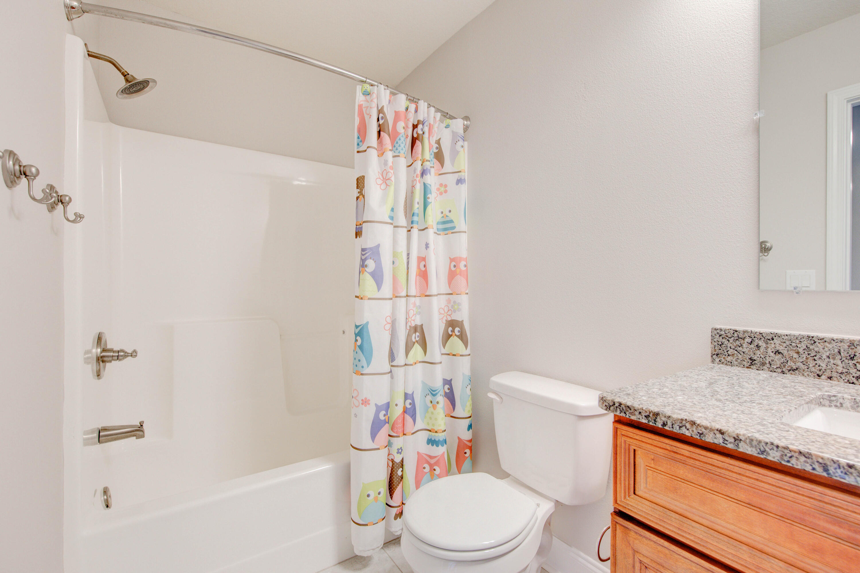 4557 Hermosa Road Crestview, FL 32539 - Photo 23 of 29 a bathroom with a sink a toilet and shower