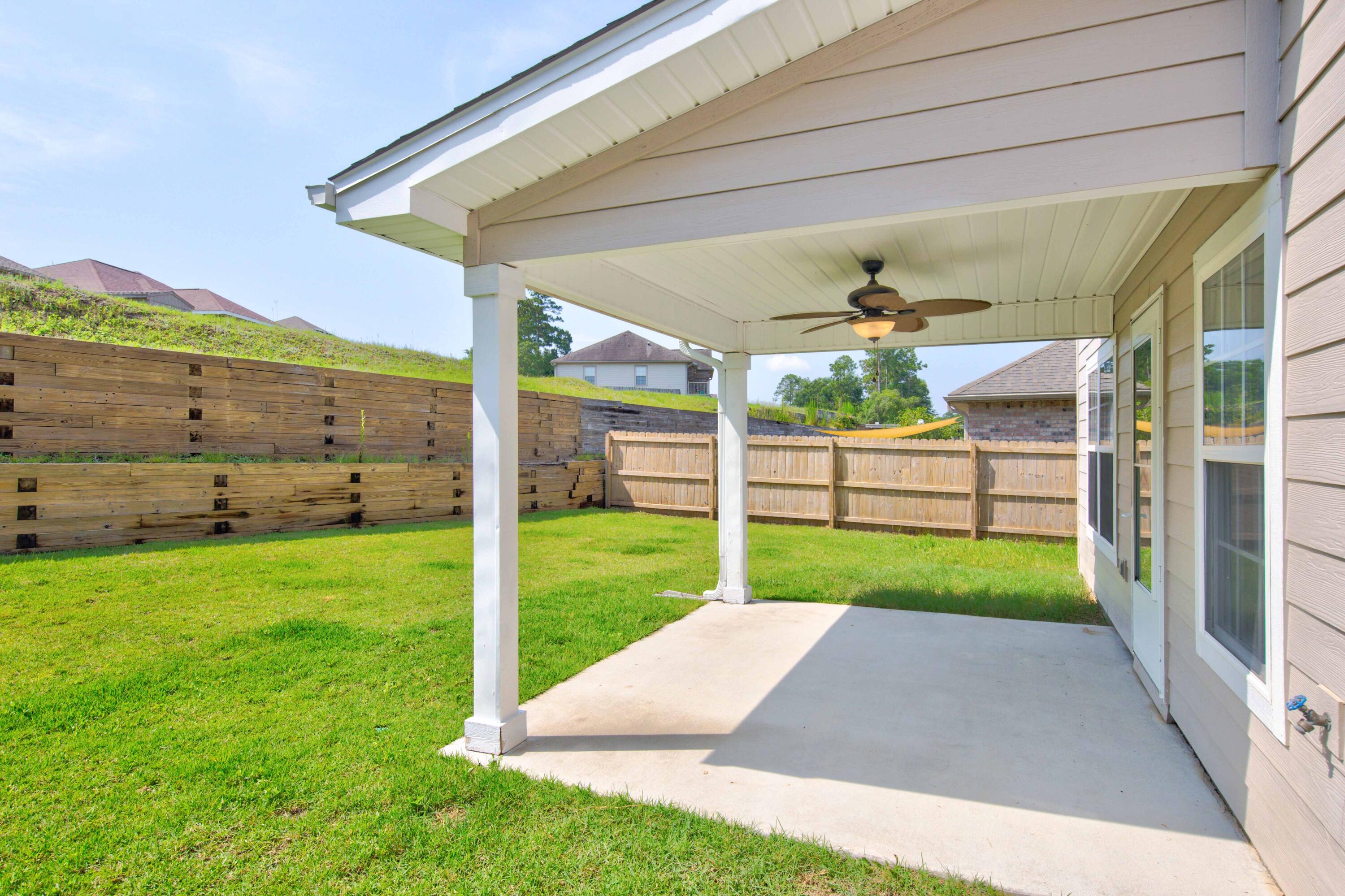 4557 Hermosa Road Crestview, FL 32539 - Photo 5 of 29 a view of a porch and garden