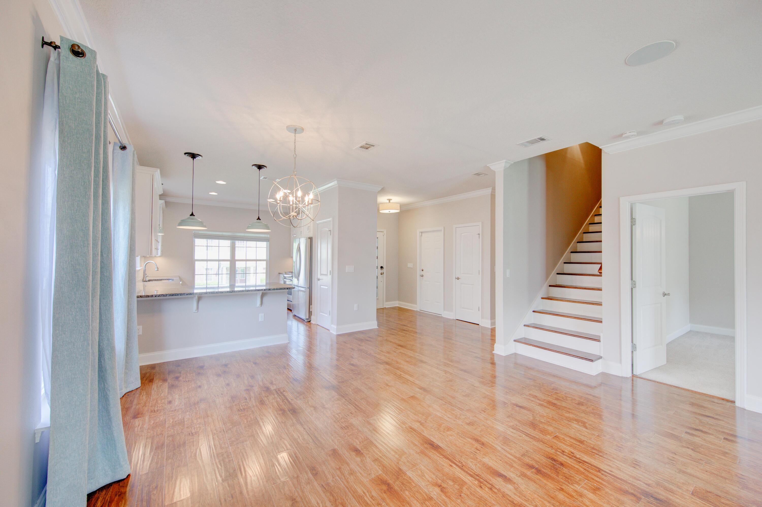 4557 Hermosa Road Crestview, FL 32539 - Photo 7 of 29 a view of a hallway with wooden floor and entryway
