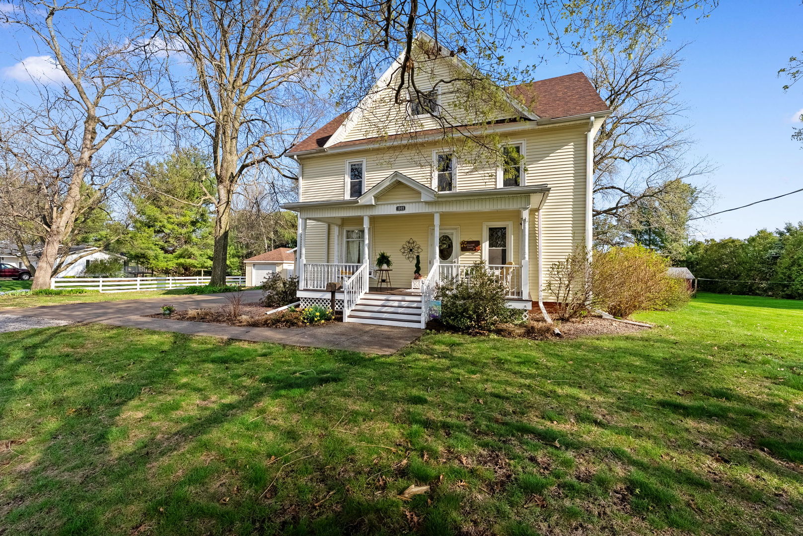a view of a house with backyard sitting area and garden