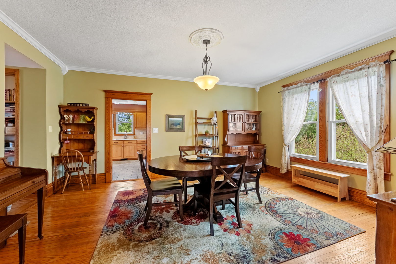 1009 Northwest 3rd Street Aledo, IL 61231 - Photo 11 of 27 a view of a dining room with furniture window and wooden floor
