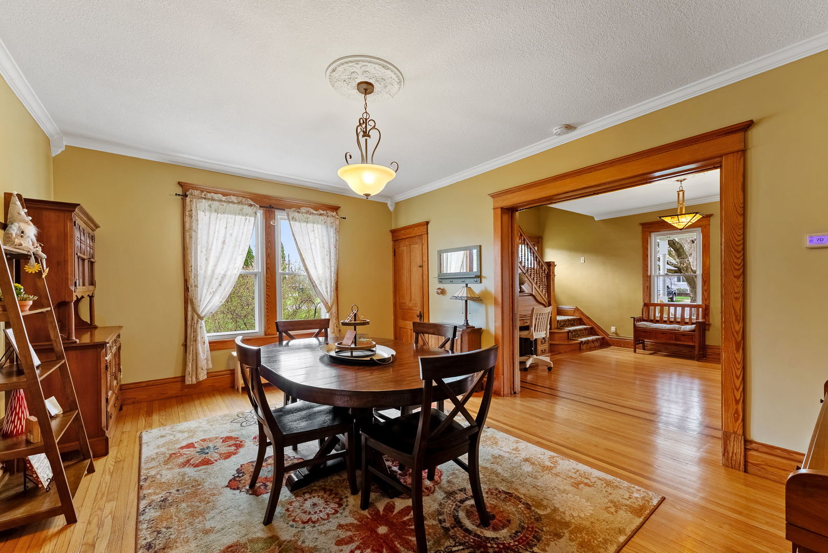 1009 Northwest 3rd Street Aledo, IL 61231 - Photo 12 of 27 a view of a dining room with furniture window and wooden floor