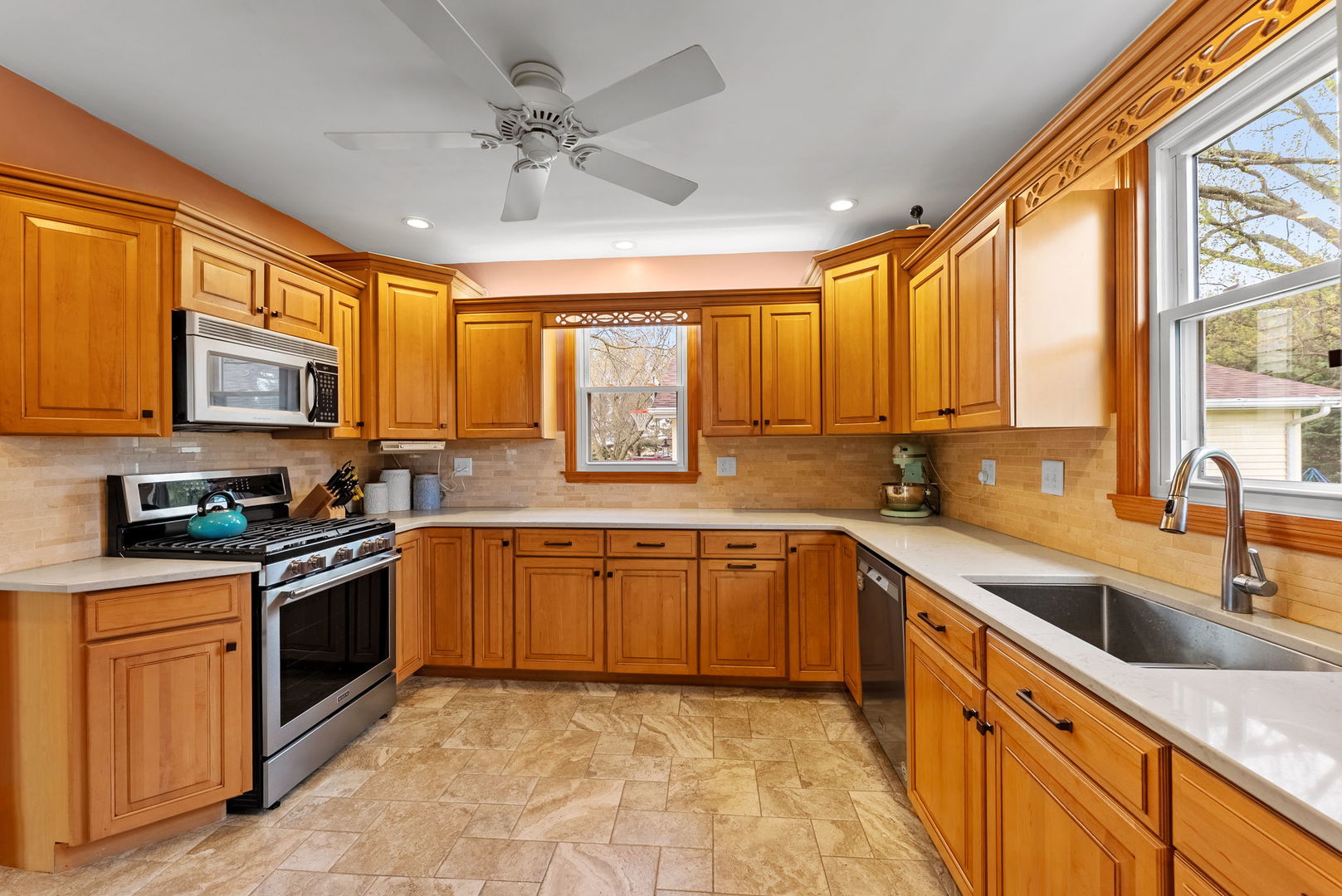 1009 Northwest 3rd Street Aledo, IL 61231 - Photo 14 of 27 a kitchen with stainless steel appliances granite countertop a sink dishwasher stove top oven and cabinets