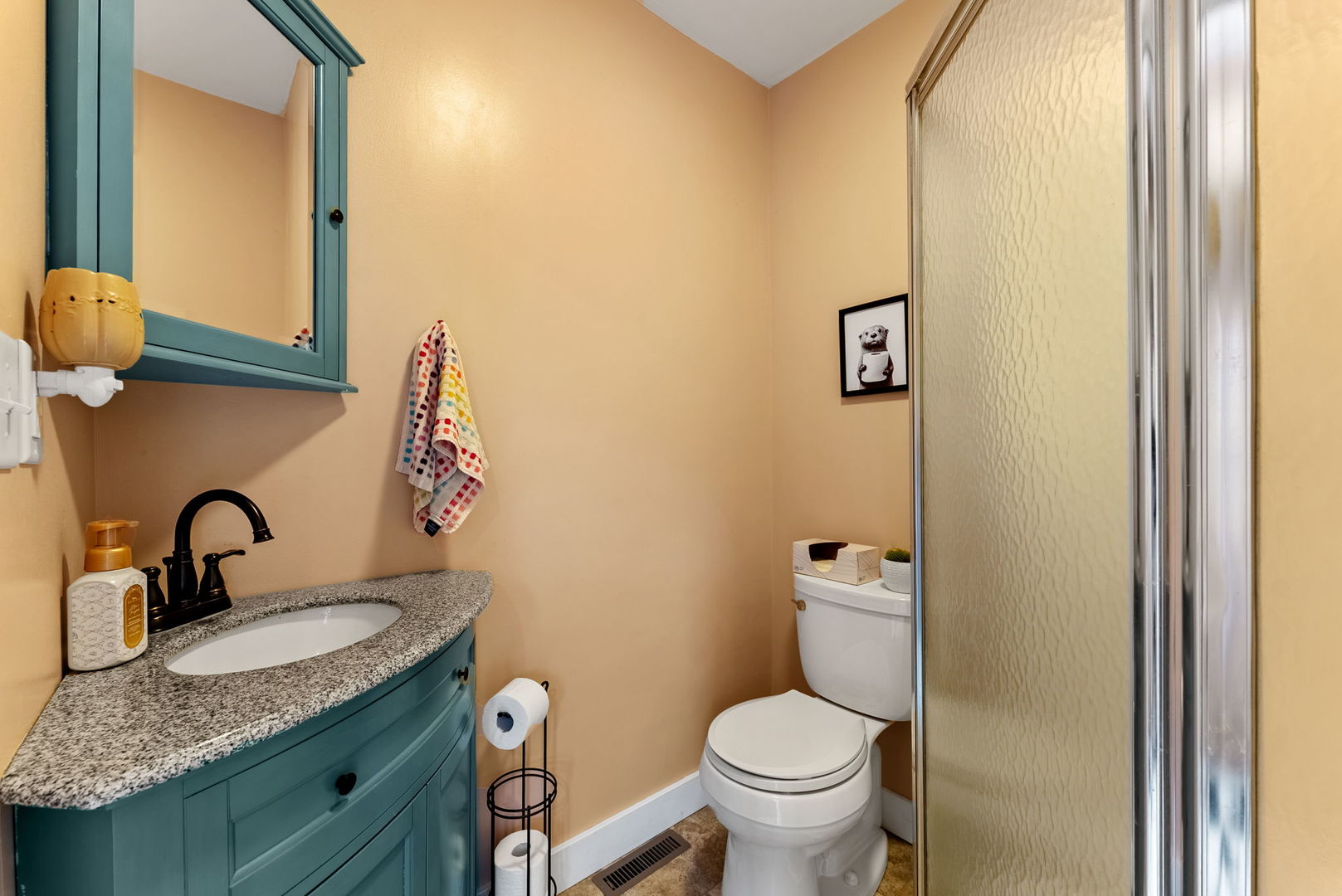 1009 Northwest 3rd Street Aledo, IL 61231 - Photo 16 of 27 a bathroom with a granite countertop sink and a mirror