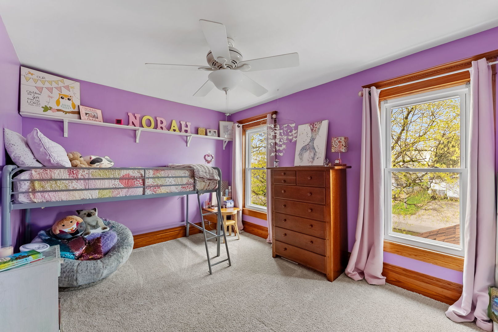 1009 Northwest 3rd Street Aledo, IL 61231 - Photo 19 of 27 a bedroom with a bed and a chandelier