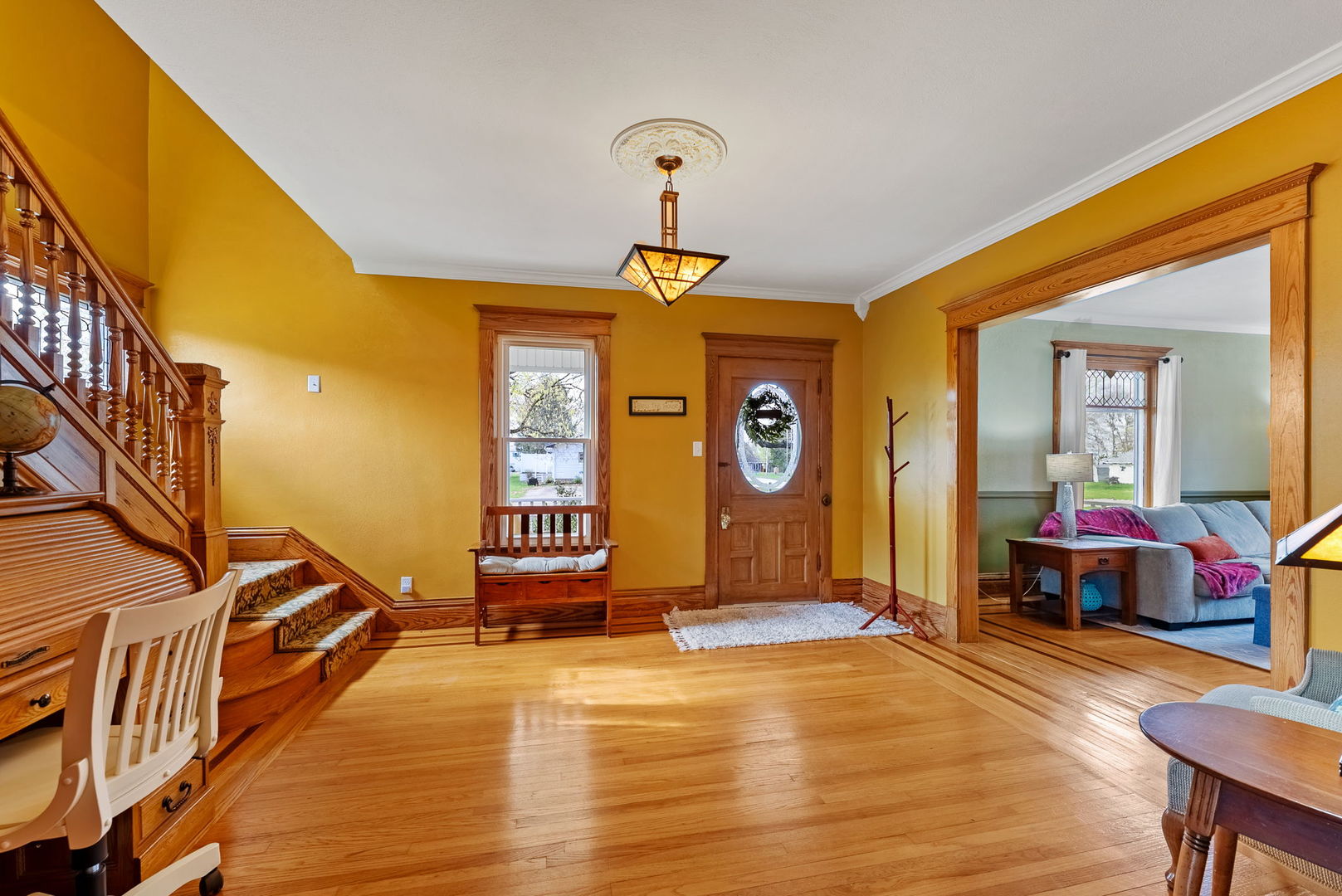 1009 Northwest 3rd Street Aledo, IL 61231 - Photo 4 of 27 a view of a livingroom with furniture staircase and a ceiling fan