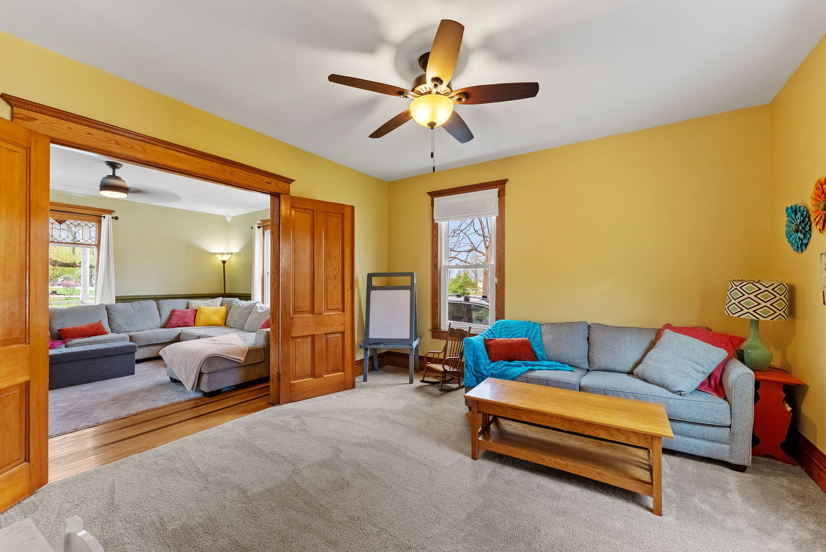 1009 Northwest 3rd Street Aledo, IL 61231 - Photo 10 of 27 a living room with furniture and a chandelier