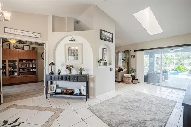 a bedroom with a large bed and a large window