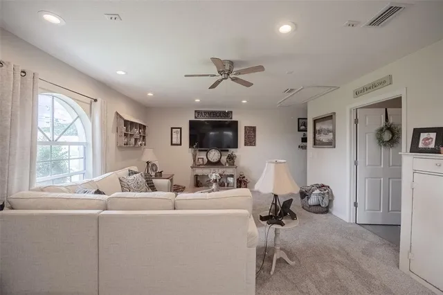 a view of a house with a yard and sitting area