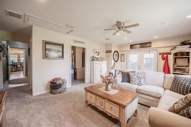 a front view of house with yard and trees