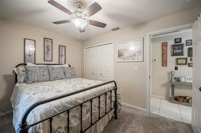 an aerial view of a house with a yard and lake view