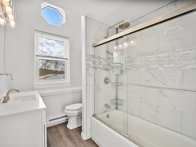 a bathroom with a bathtub and sink