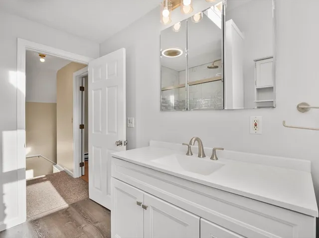 a bathroom with a sink and a mirror