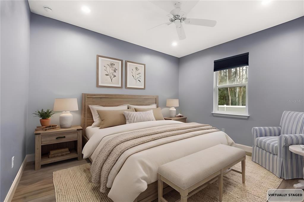 4 Uturn Court Palm Coast, FL 32164 - Photo 14 of 26 a bedroom with a bed and a couch