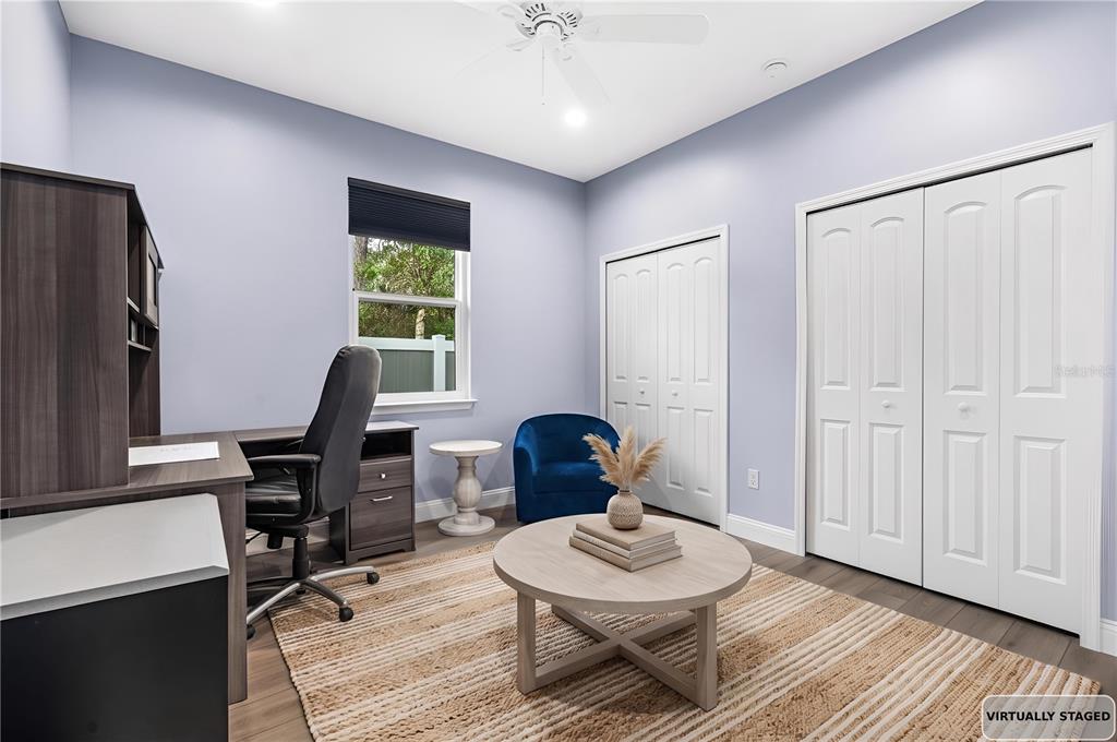 4 Uturn Court Palm Coast, FL 32164 - Photo 18 of 26 a view of a workspace with furniture and a window