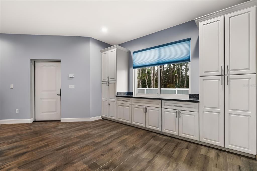 4 Uturn Court Palm Coast, FL 32164 - Photo 5 of 26 a large white kitchen with a large window