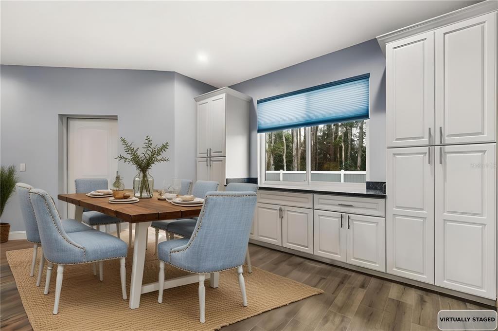 4 Uturn Court Palm Coast, FL 32164 - Photo 6 of 26 a dining room with furniture and window
