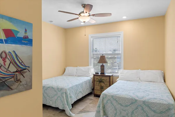 a bedroom with a bed and a lamp