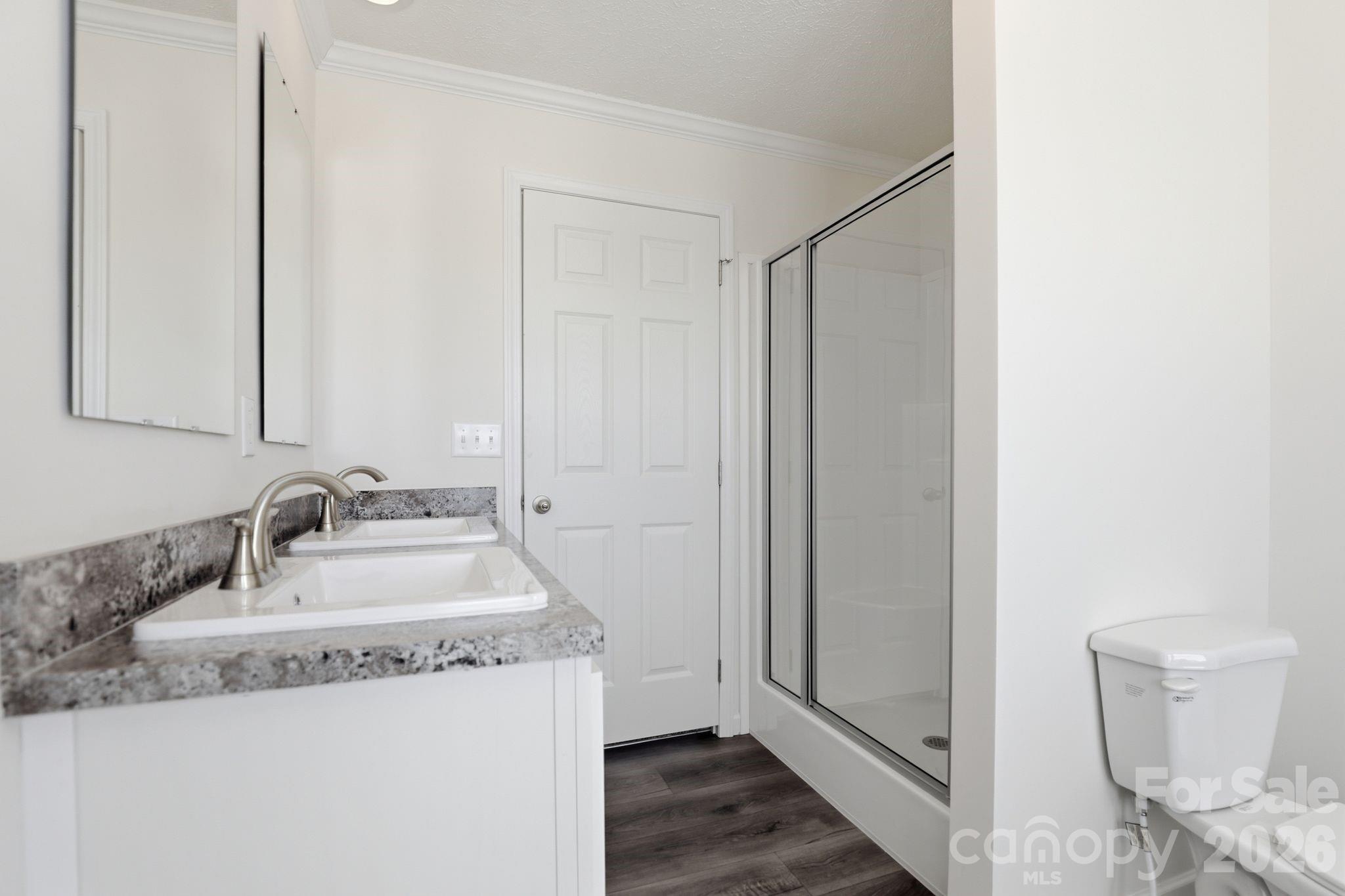 197 Burleson Point Woodleaf, NC 27054 - Photo 16 of 30 a bathroom with a sink and a mirror