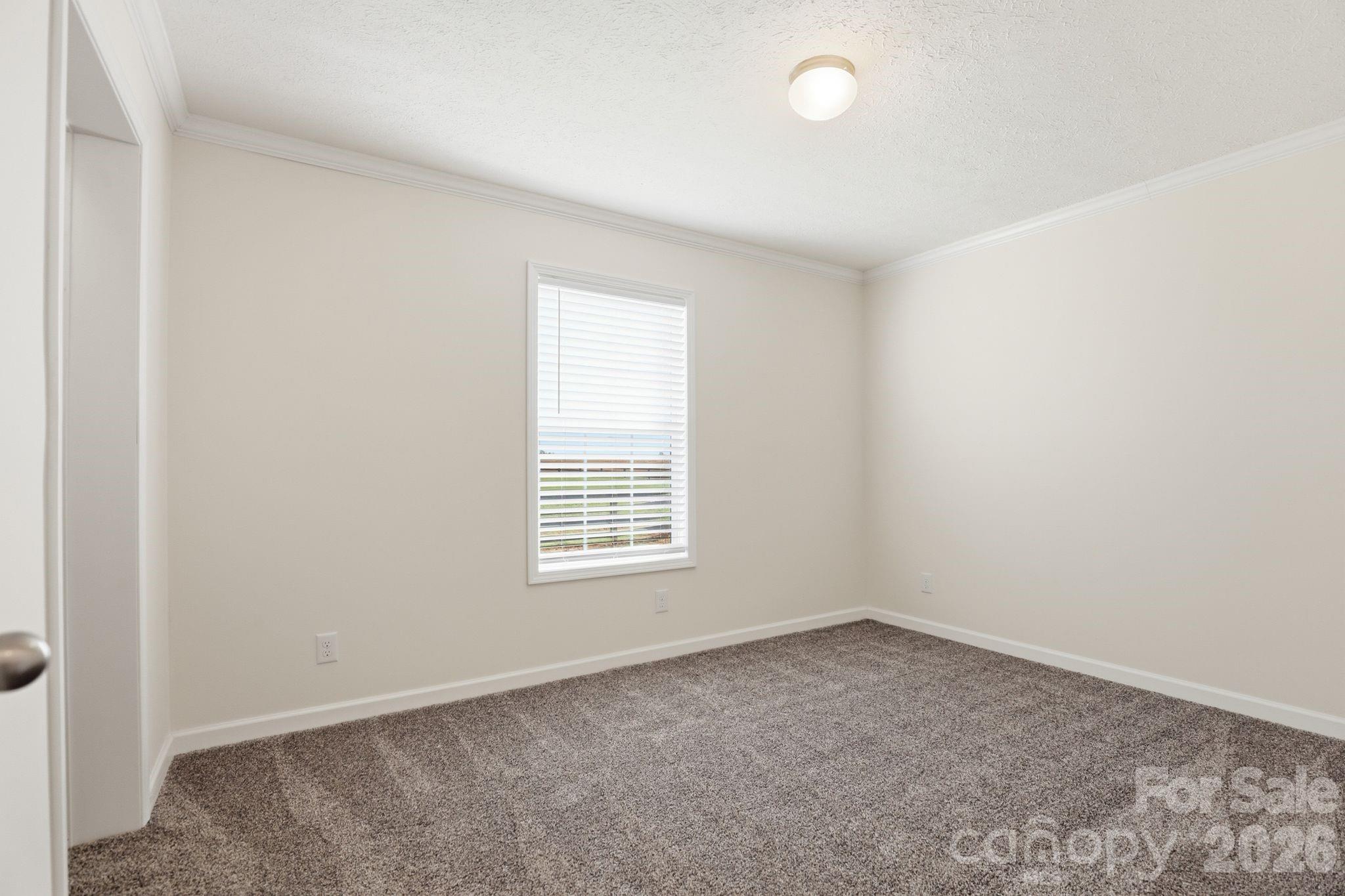 197 Burleson Point Woodleaf, NC 27054 - Photo 18 of 30 an empty room with a window