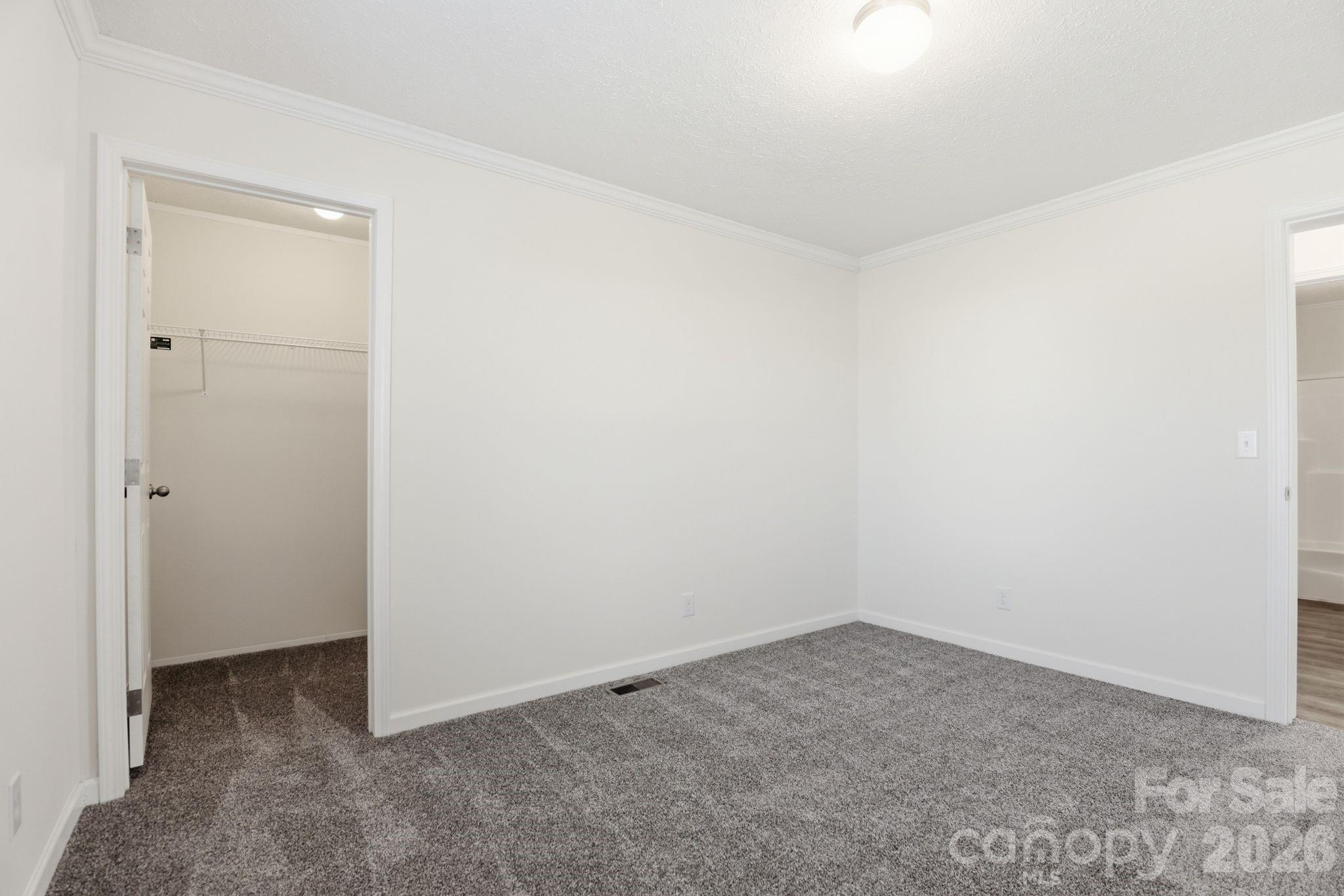 197 Burleson Point Woodleaf, NC 27054 - Photo 19 of 30 an empty room with a workbench