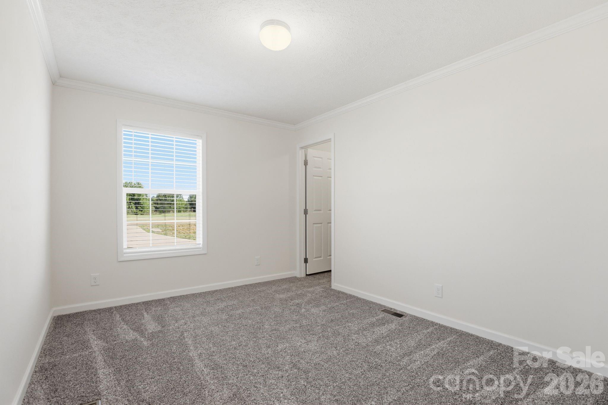 197 Burleson Point Woodleaf, NC 27054 - Photo 22 of 30 an empty room with a window