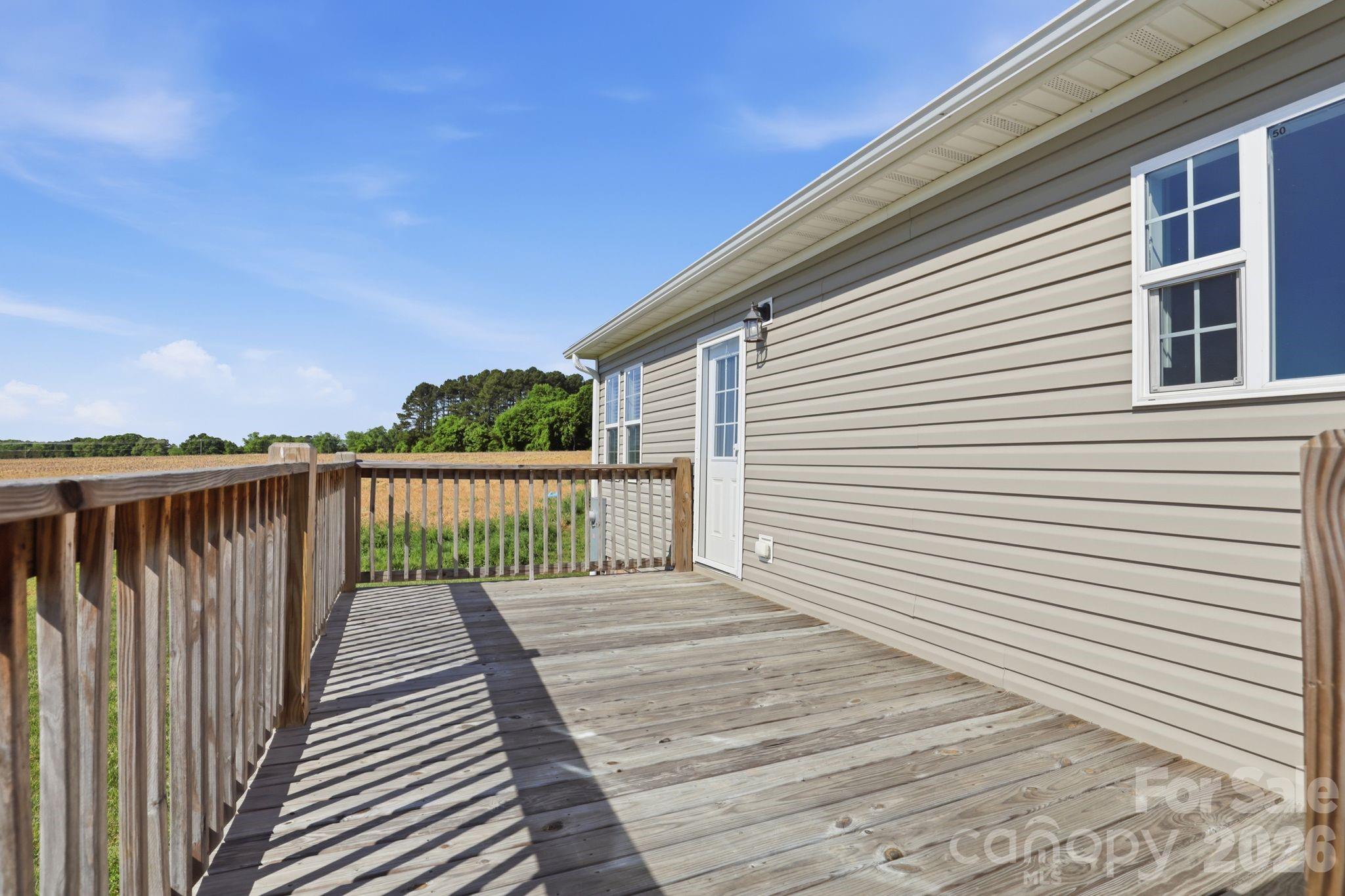 197 Burleson Point Woodleaf, NC 27054 - Photo 25 of 30 a view of a wooden deck