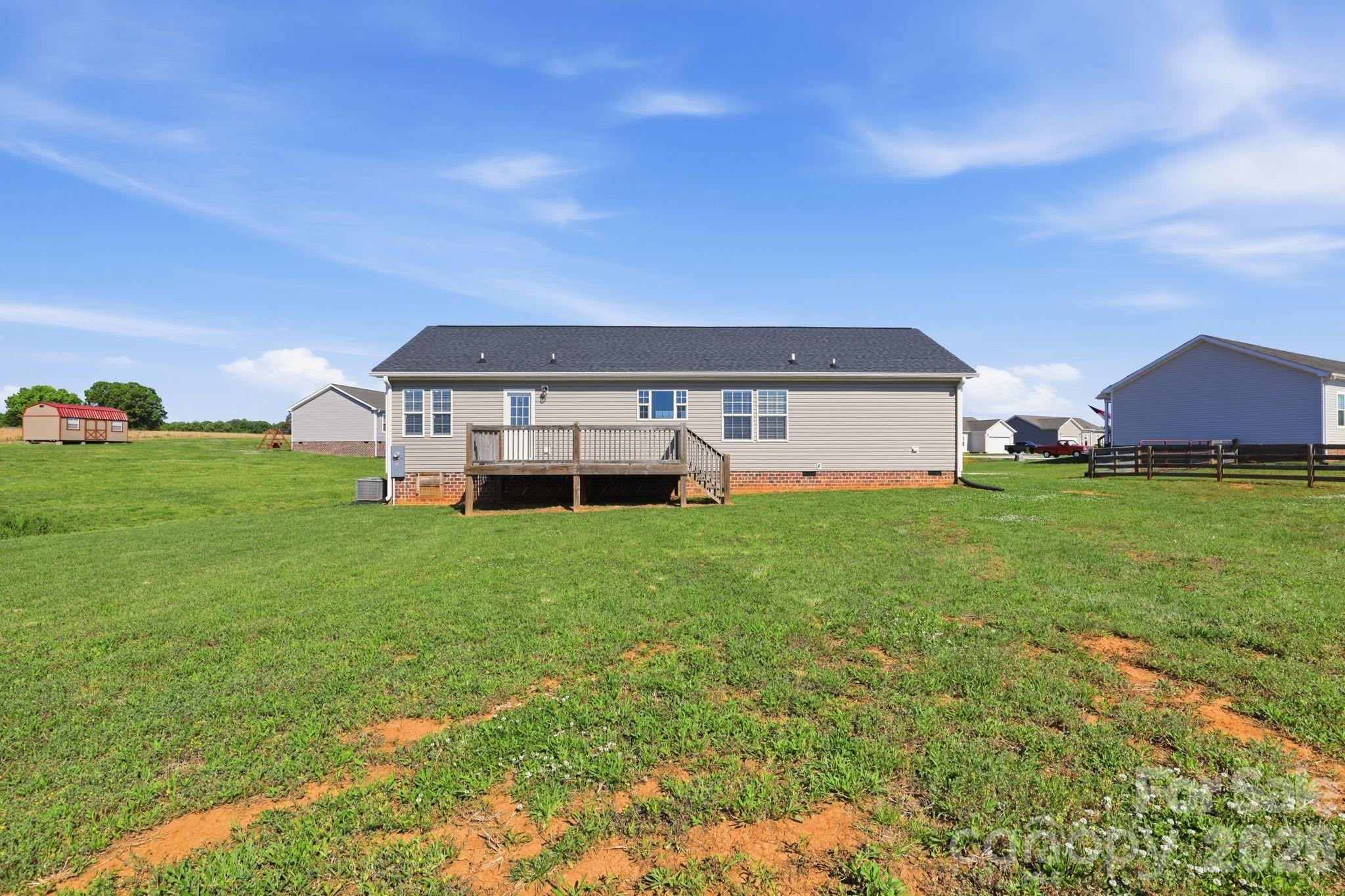 197 Burleson Point Woodleaf, NC 27054 - Photo 27 of 30 a front view of house with garden