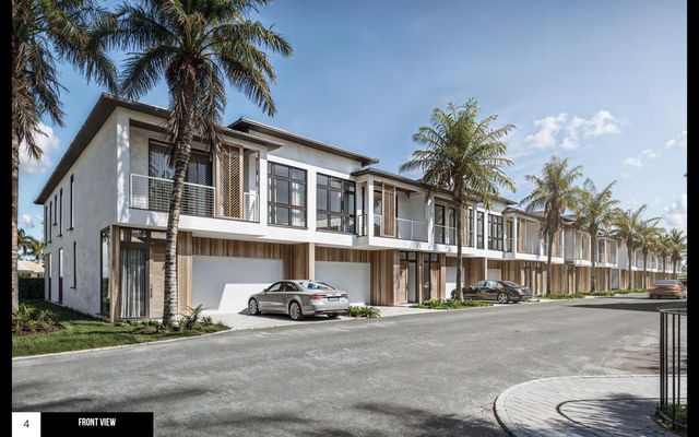 a view of a building with a yard