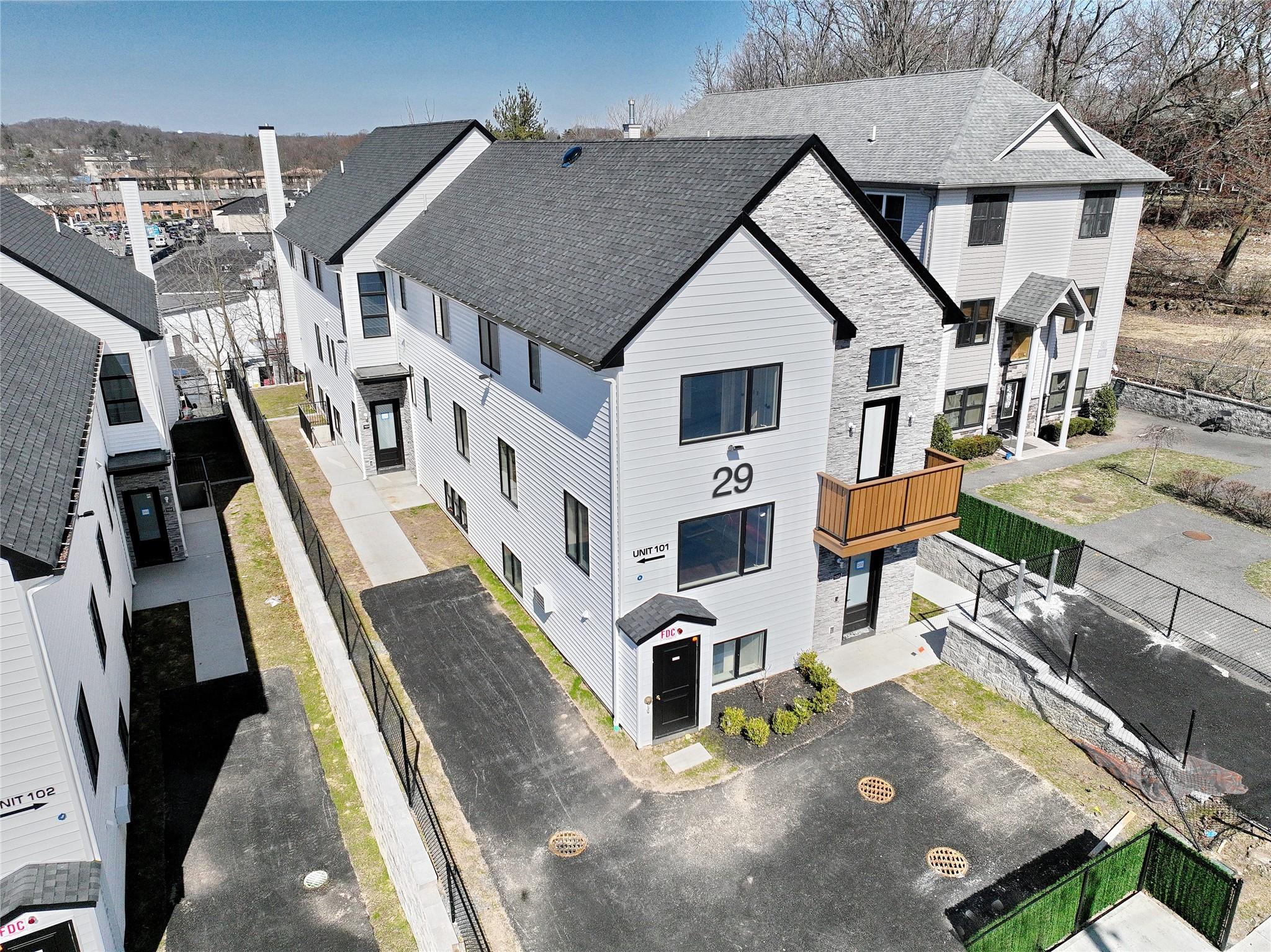 an aerial view of residential houses with outdoor space