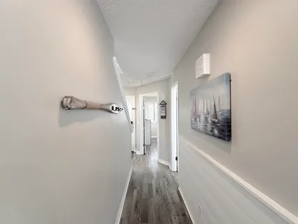 a bedroom with a bed and a lamp