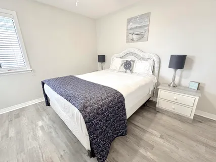 a bedroom with a bed and a television