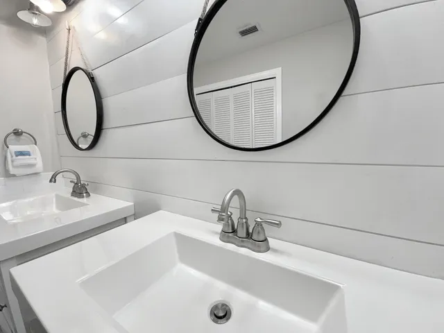 a bedroom with a bed a window and couch