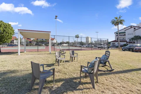 a view of houses with an outdoor space and seating area