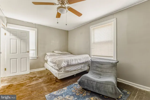 a bedroom with bed and window