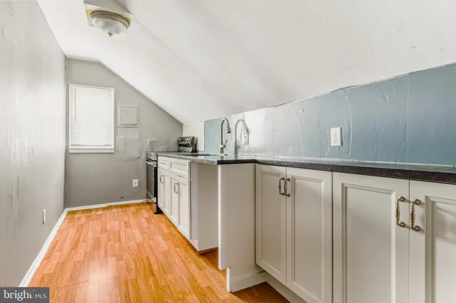 a view of a kitchen with electric appliances