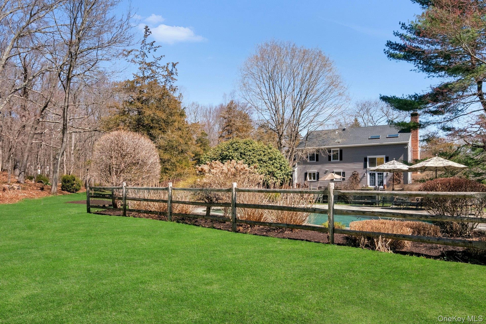 83 Upper Shad Road Pound Ridge, NY 10576 - Photo 36 of 47 View of house from behind pool