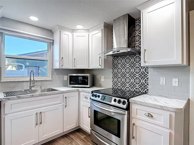 a kitchen with a stove and a microwave