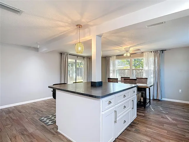 a kitchen with a refrigerator stove and sink