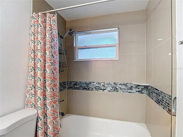 a view of a room with a window and a table