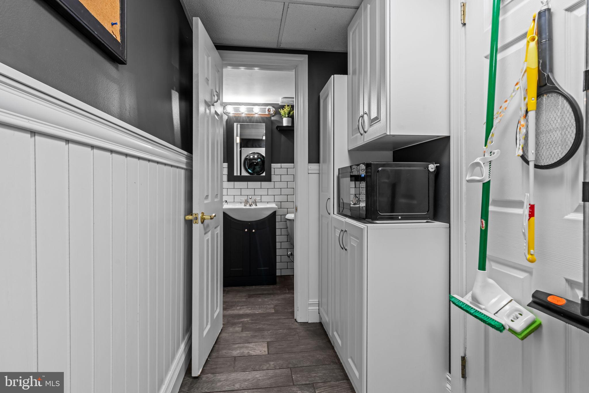 809 Millwood Road Philadelphia, PA 19115 - Photo 12 of 22 a kitchen with a refrigerator and cabinets
