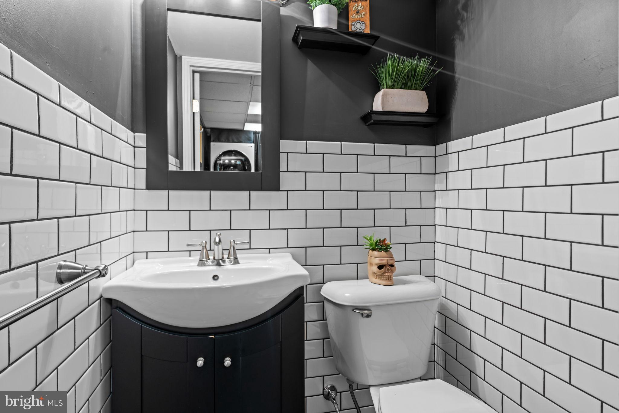 809 Millwood Road Philadelphia, PA 19115 - Photo 13 of 22 a bathroom with a sink and a toilet