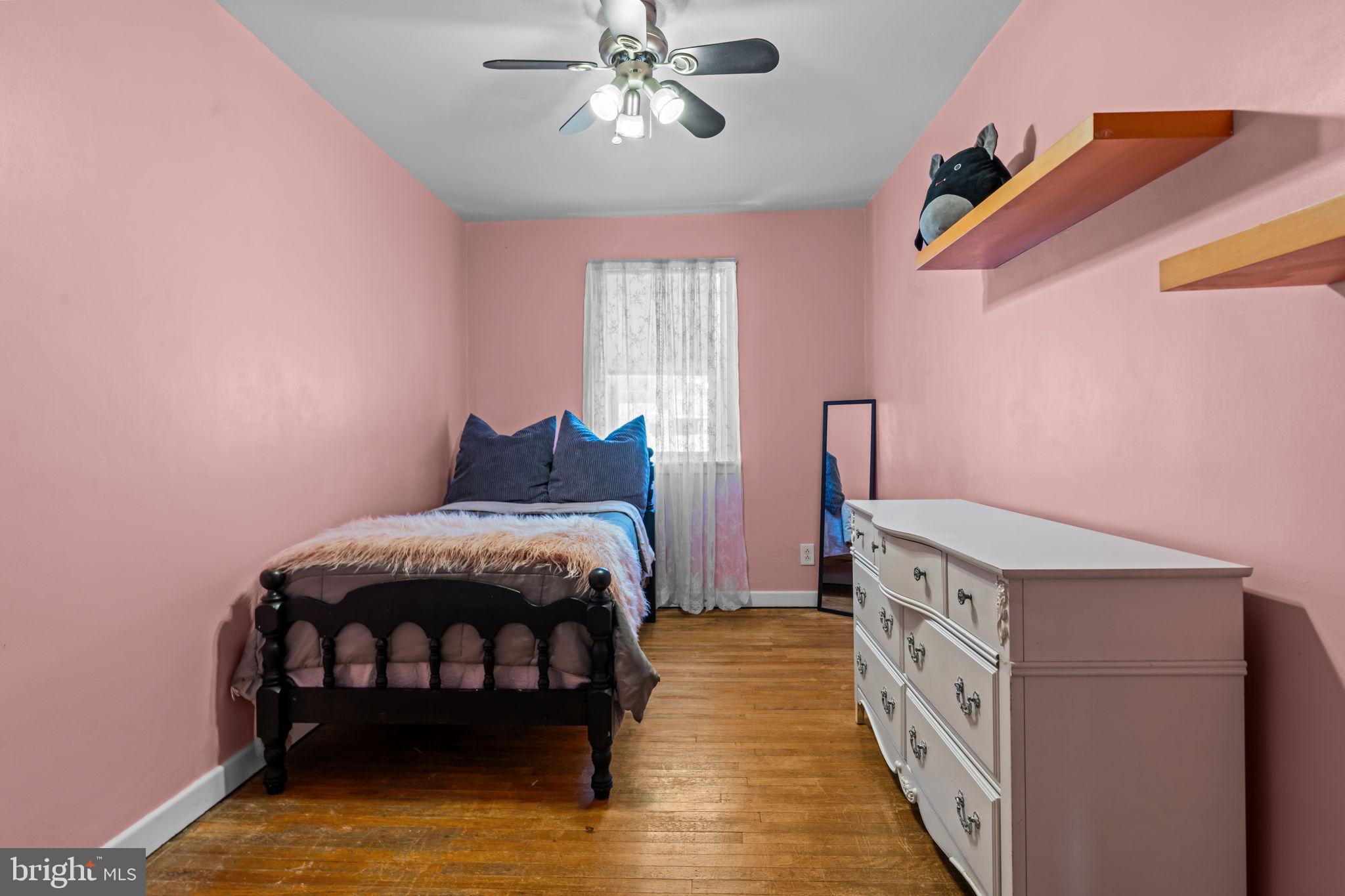 809 Millwood Road Philadelphia, PA 19115 - Photo 15 of 22 a bedroom with a bed and a chandelier