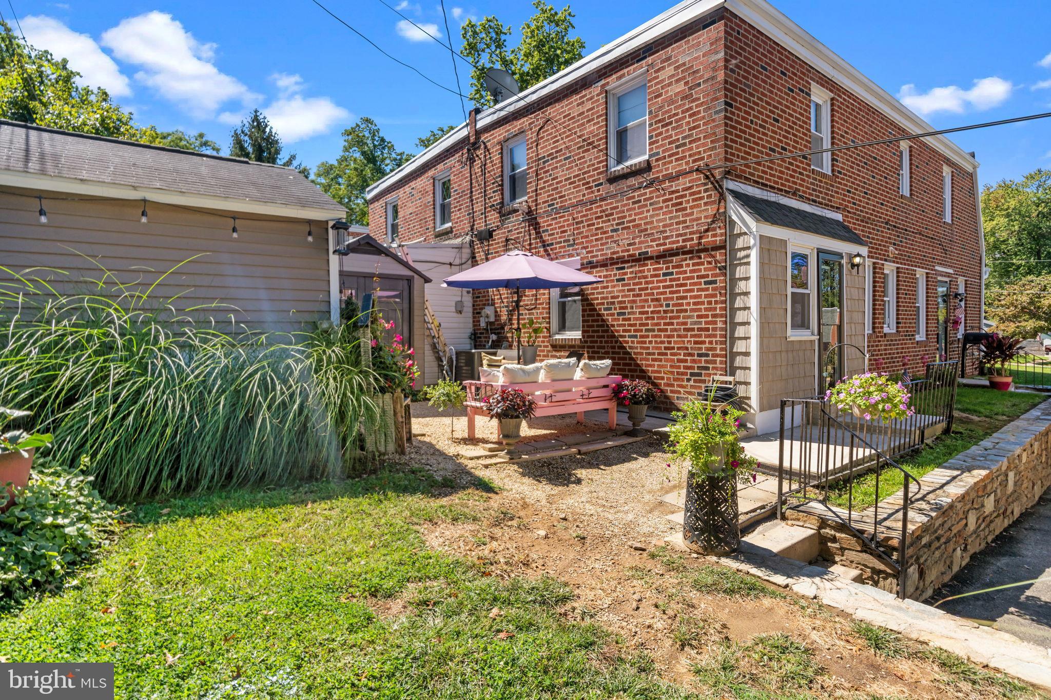 809 Millwood Road Philadelphia, PA 19115 - Photo 20 of 22 a view of a house with a yard and sitting area