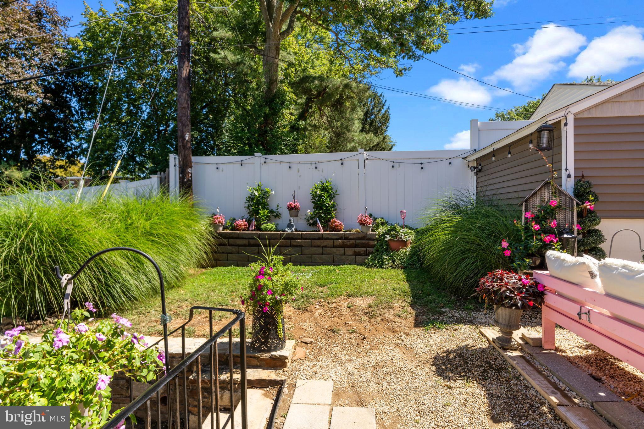 809 Millwood Road Philadelphia, PA 19115 - Photo 21 of 22 a view of a chairs and table in a backyard